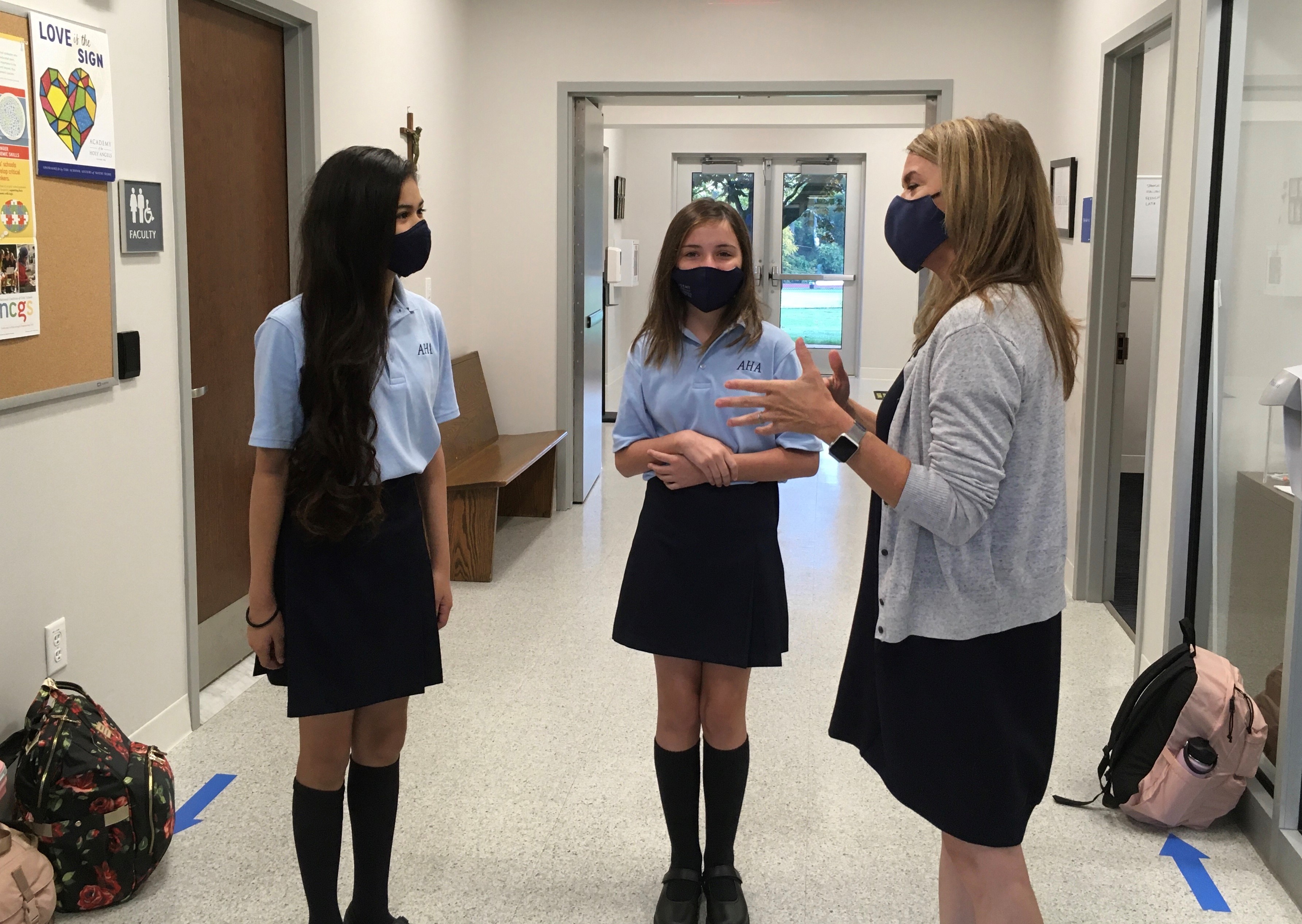 Nurse Kelly greets students