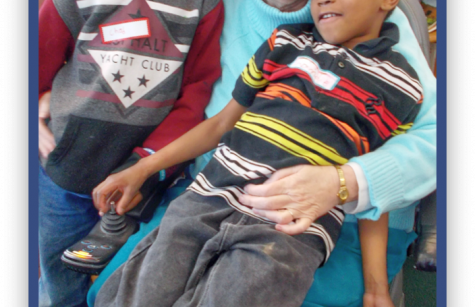 Sister Evelyn with two students from the Notre Dame Learning Center