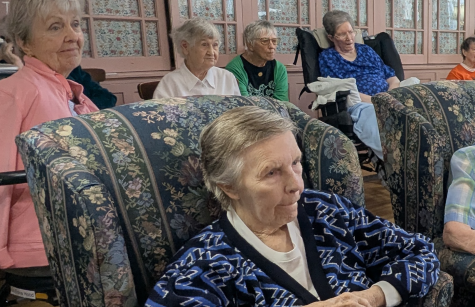 Sisters listen to Farmer Russ