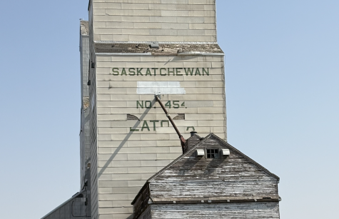 photo of an old grain tower in Saskatchewan  with a blue sky