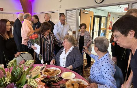 Sister Henrice at a table with flowers