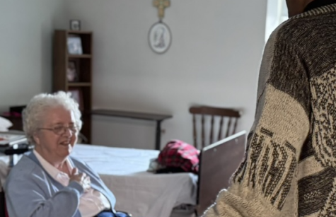 Father Gaddy blesses Sister Virginia Brien's room