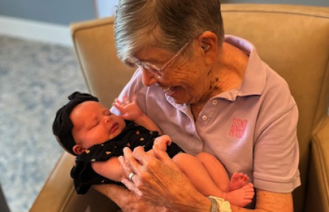 Sister Julice Bots holds Baby Noona