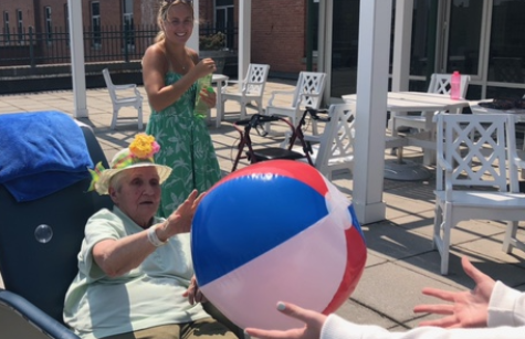 Sister Peg Mattare plays beach ball.